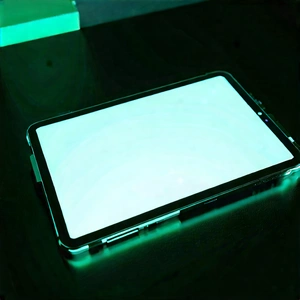 Tablet With Glowing Screen With Table Cell