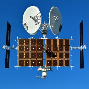 A Large Satellite Dish With A Smaller Dish Attached To It