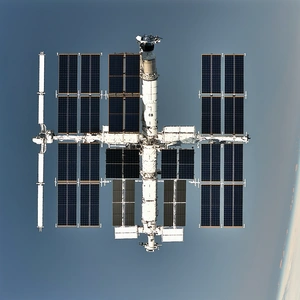 A Large Space Station With A White And Black Color Scheme