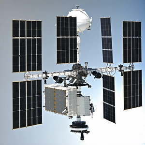 A Large Spacecraft With A White And Black Color Scheme