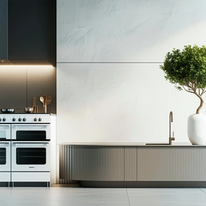 The image features a modern kitchen with a large white countertop.