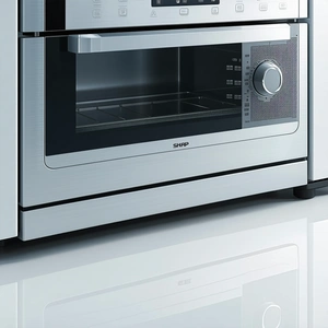 The image features a modern kitchen with a stainless steel oven and...