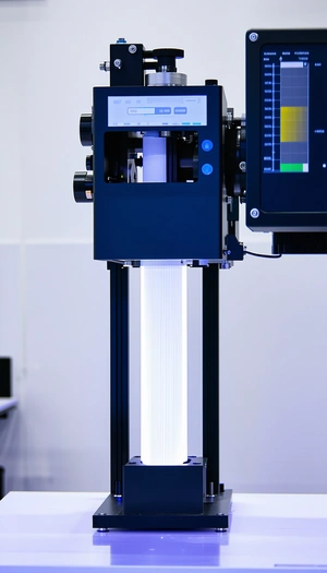 A Large Blue Machine With A Light On Top Of It