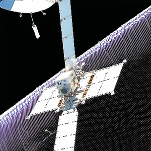 A Space Station Is Shown In The Image, With A Large Satellite Dish On The Side