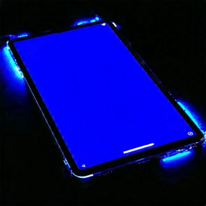 Tablet With Glowing Screen With Cell Phone