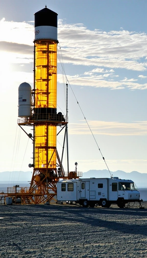 A Large Yellow Tower, Which Appears To Be A Part Of A Space Station