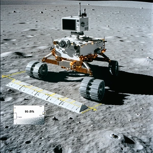 A White Robotic Vehicle, Possibly A Rover, Sitting On A Rocky Surface