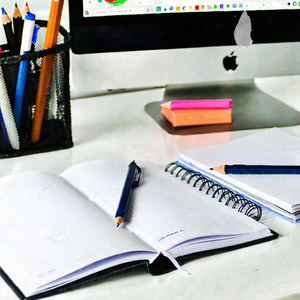 Business Minimalist Design: Workplace with notebooks and pens on desk